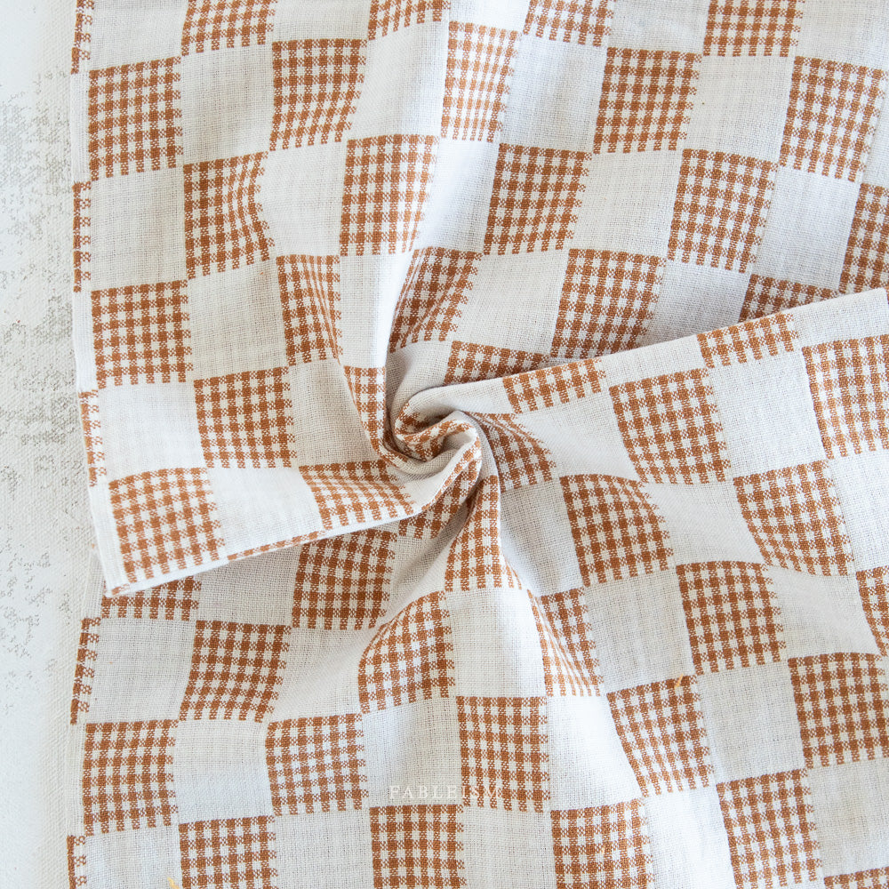 Brown and white checkered fabric