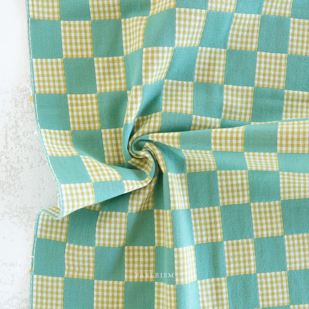 Turquoise and lime green checkered fabric
