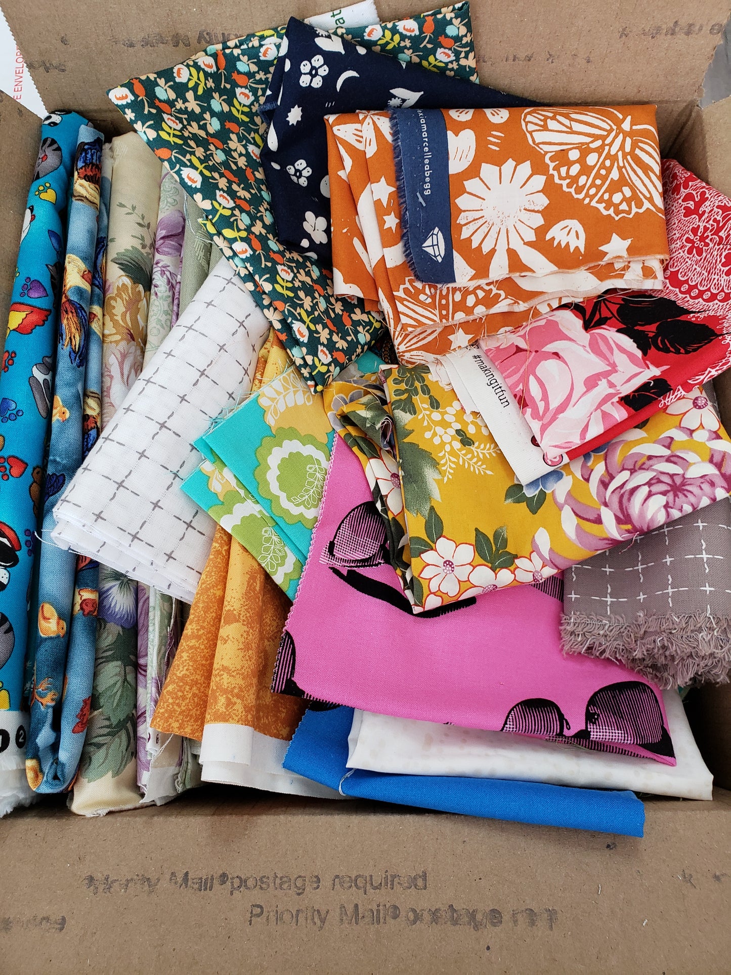 large box full of fabric scraps