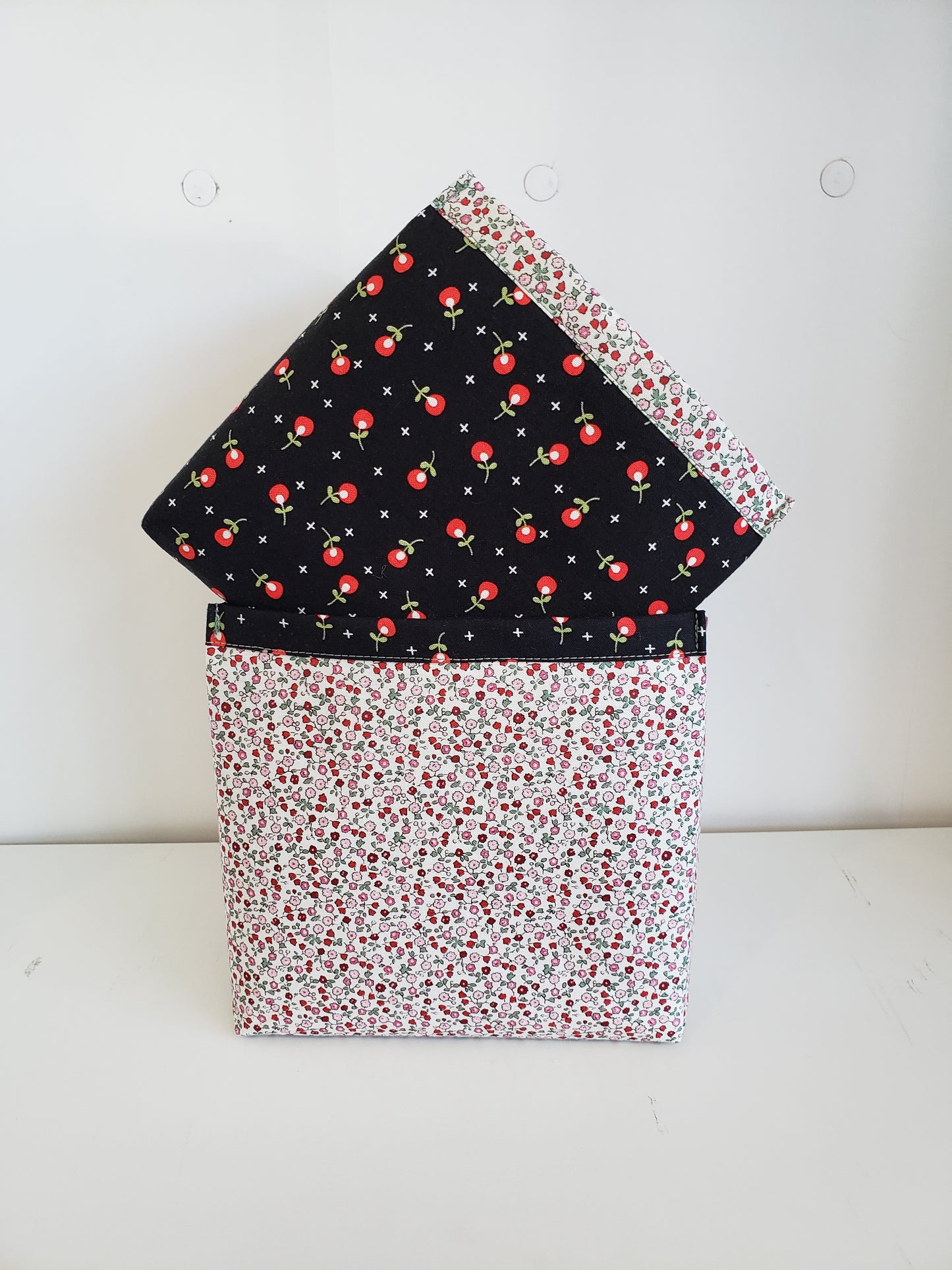 2 fabric boxes in black, red and cream