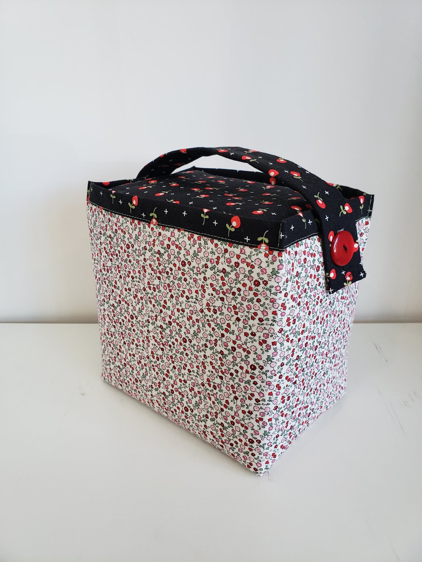 2 fabric boxes in black, red and cream