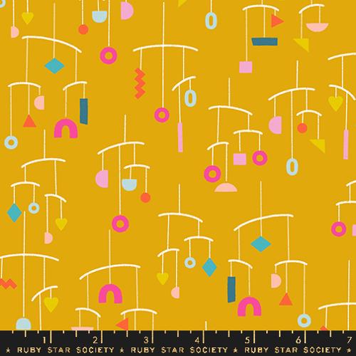 geometric mobile on yellow