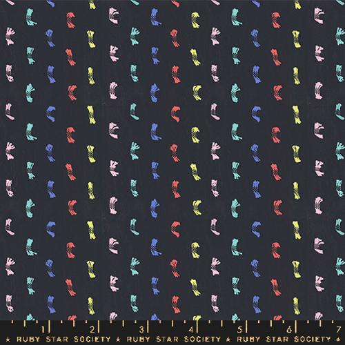 dark gray background with rainbow alternating colored woven dots
