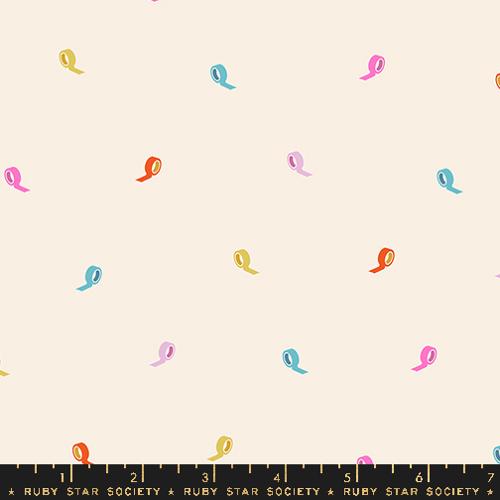 Colorful ribbon shapes on a beige background with a ruler at the bottom indicating measurements.