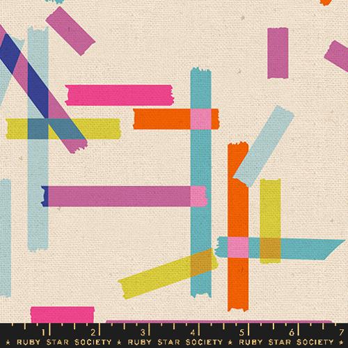 Fabric with colorful geometric pattern on a beige background, featuring Ruby Star Society label.