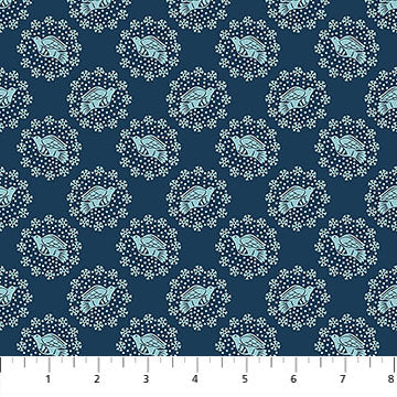 Patterned fabric with blue and white design on a blue background