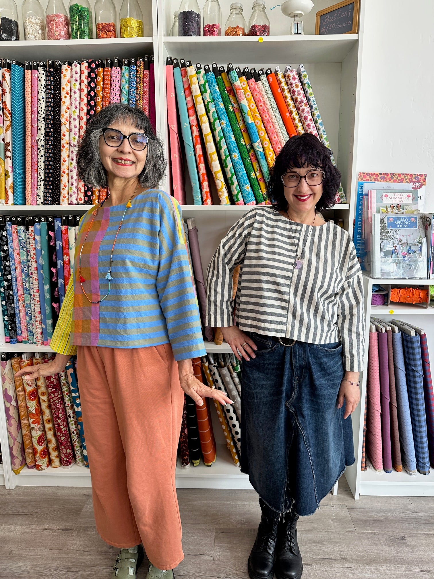 Lana and Darcy wearing color blocked shirts