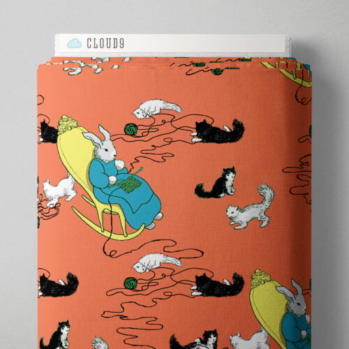 Fabric with cartoon design of a rabbit knitting and cats, branded 'Cloud9'.