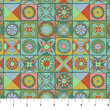 Colorful geometric patterned fabric with a ruler at the bottom