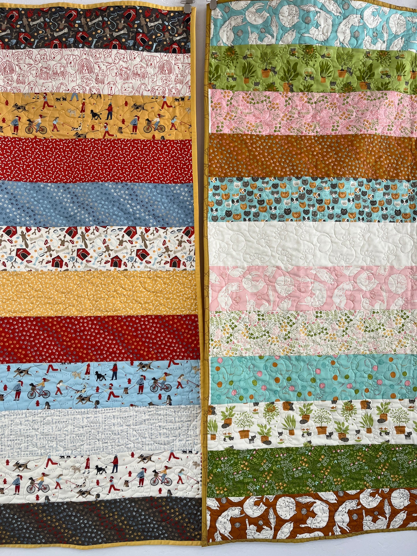 Quilt with a patchwork design featuring various patterns and colors.