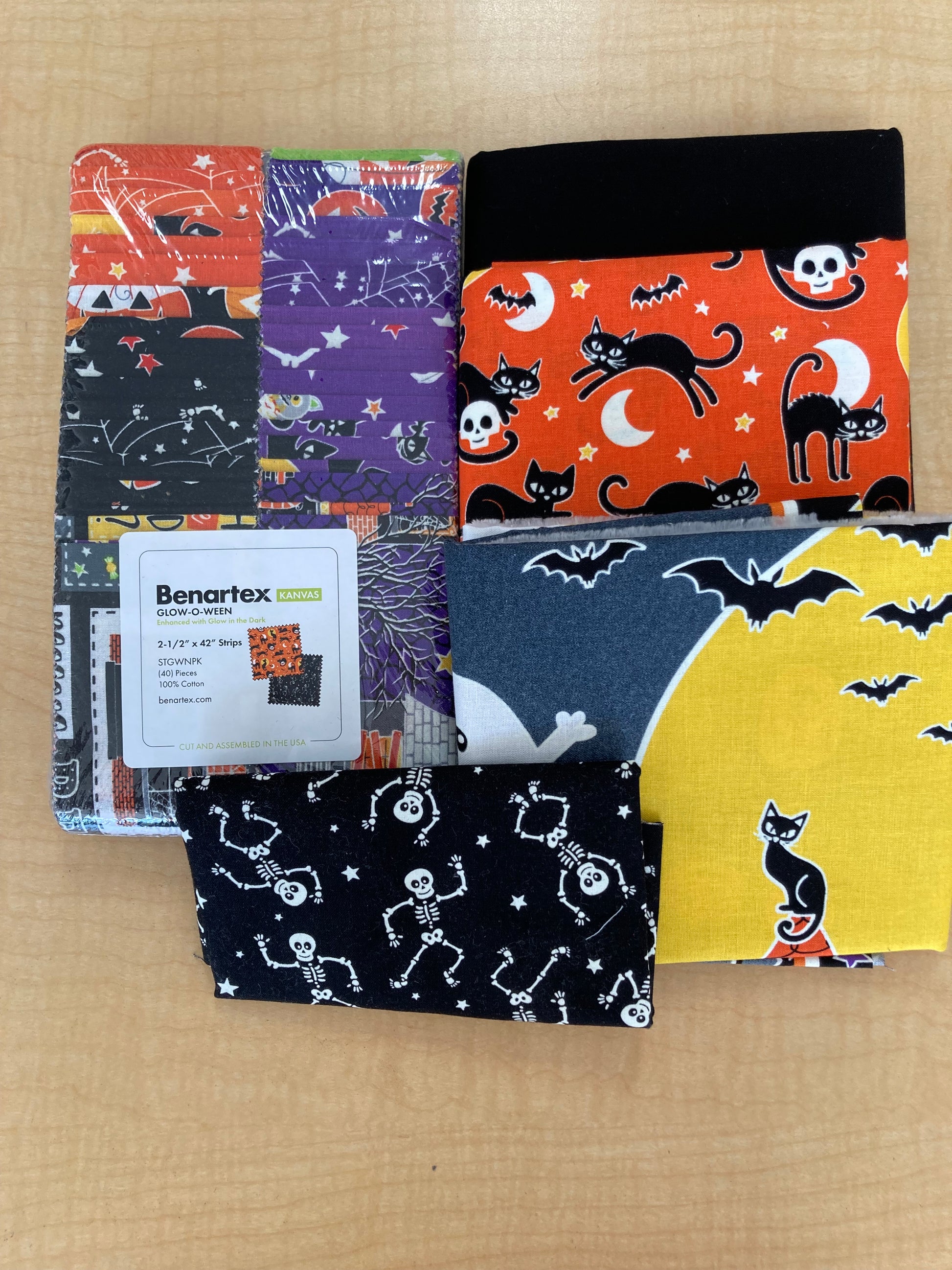 black, orange and purple fabric bundle with skeleton glow in the dark fabric