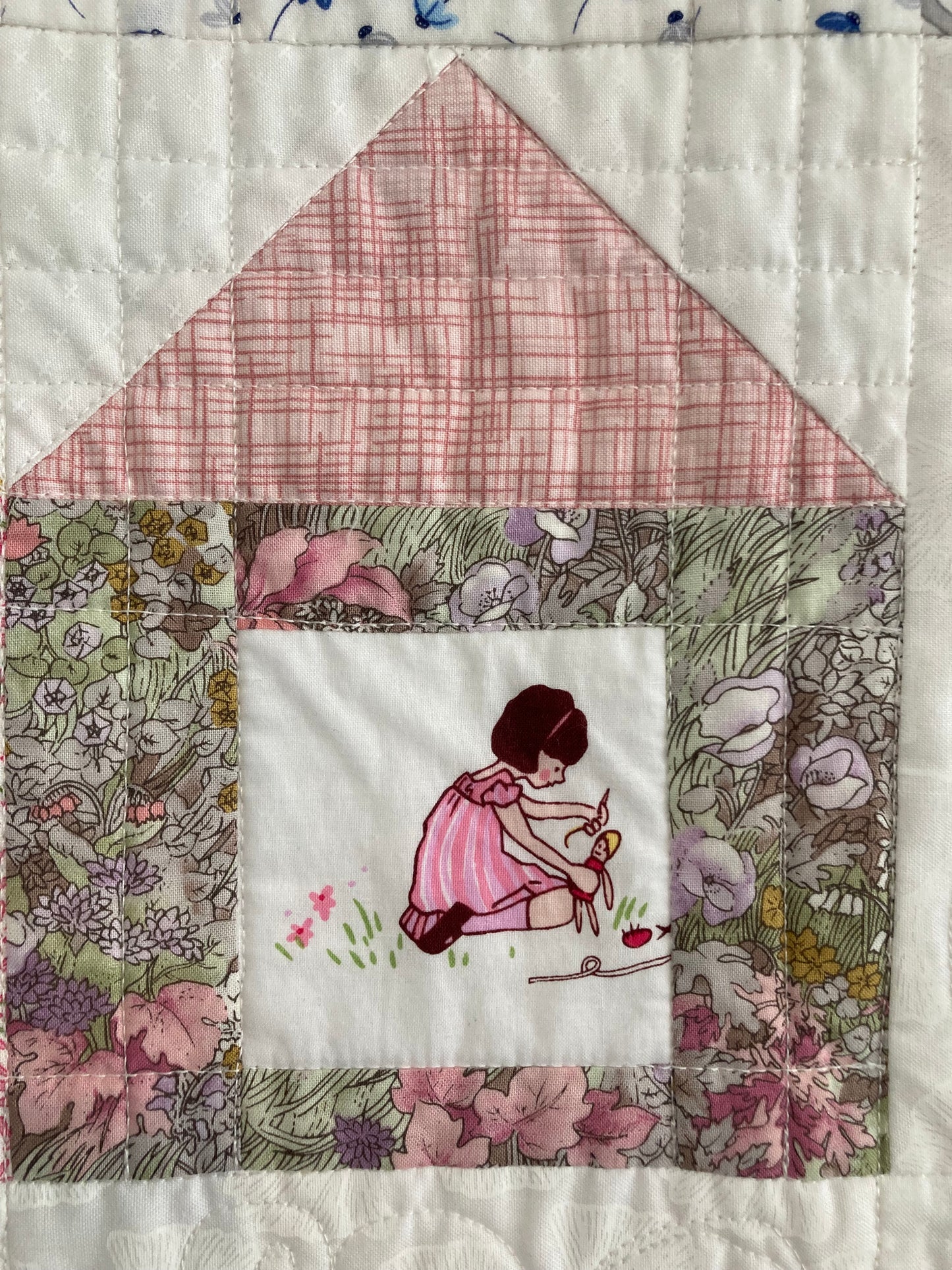 girl with doll in quilt block