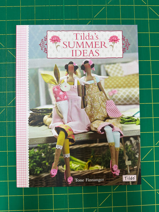 Book titled 'Tilda's Summer Ideas' on a green cutting mat