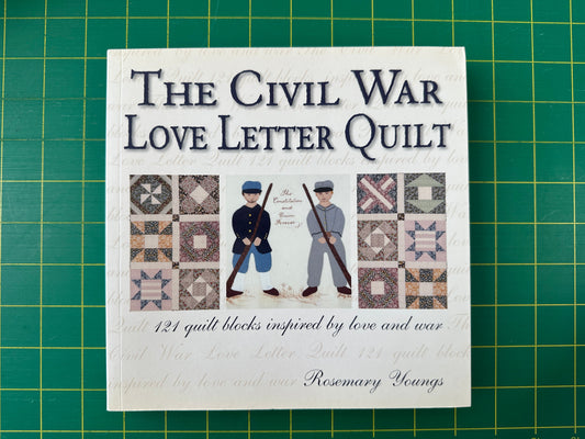 A book titled Civil War Love Letter Quilt on a green cutting mat