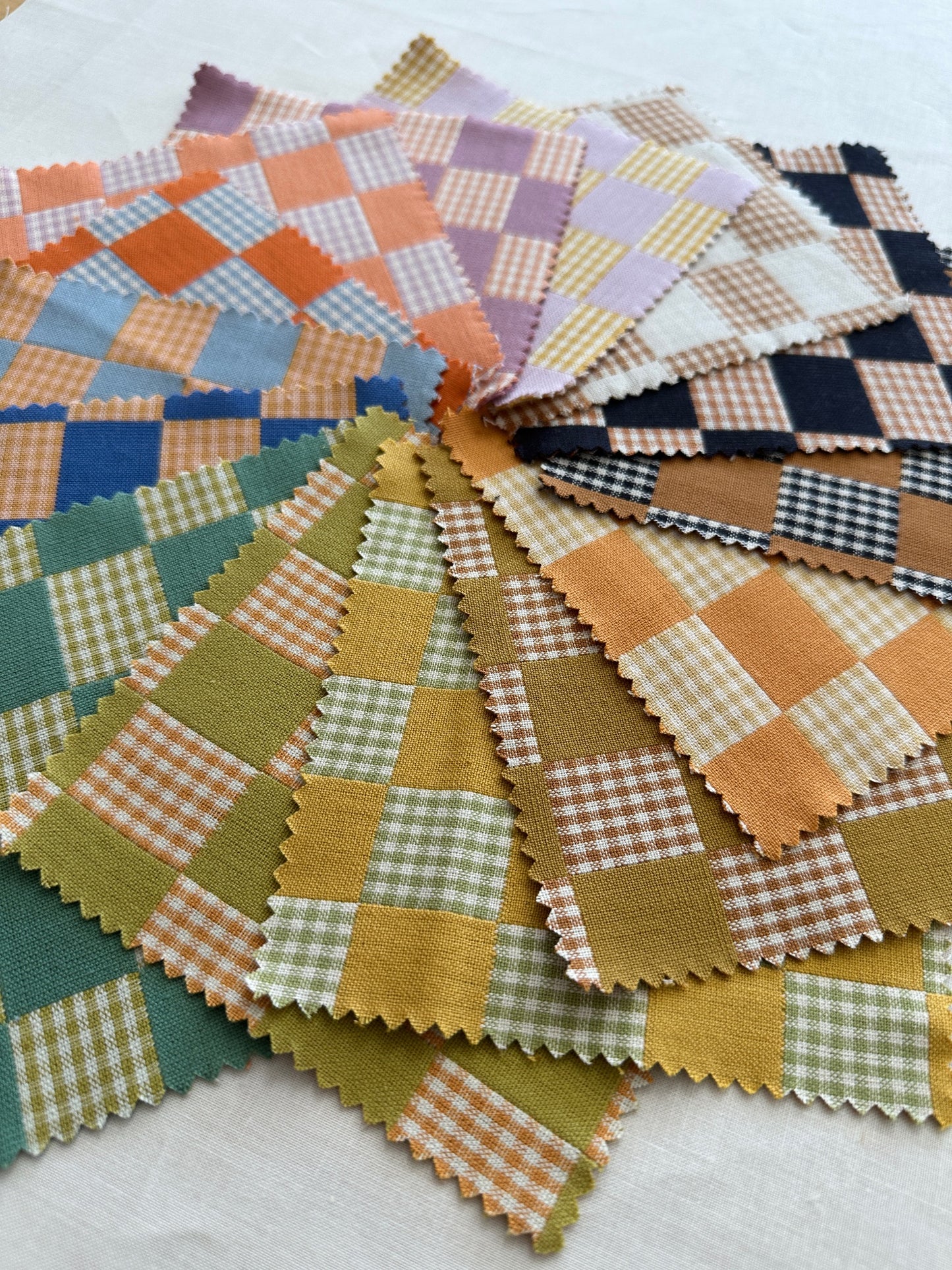 Fableism Checkmate Fabric close up, featuring squares of colorful checkered fabric