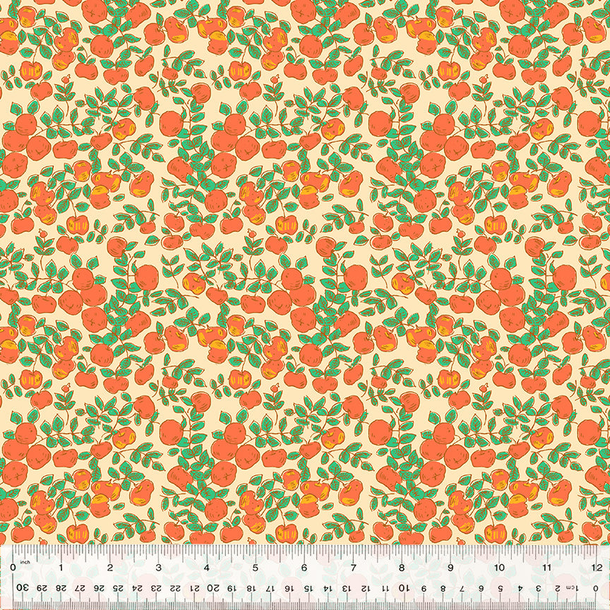 orange apples against a peach background with green leaves