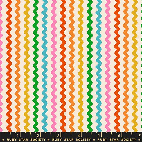 Colorful wavy pattern fabric swatch with a ruler at the bottom