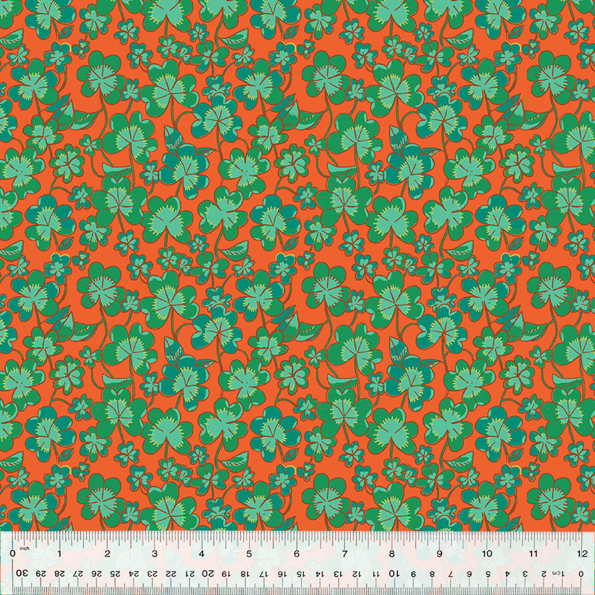 green clovers on orange fabric