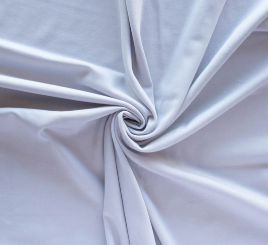 Grey fabric arranged in a swirl