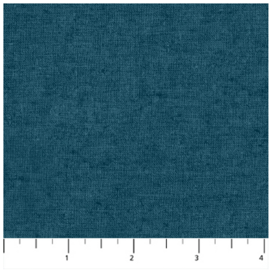 Solid blue fabric swatch with a ruler at the bottom
