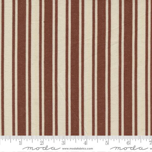 Fabric with rust and beige vertical stripes and a ruler at the bottom.