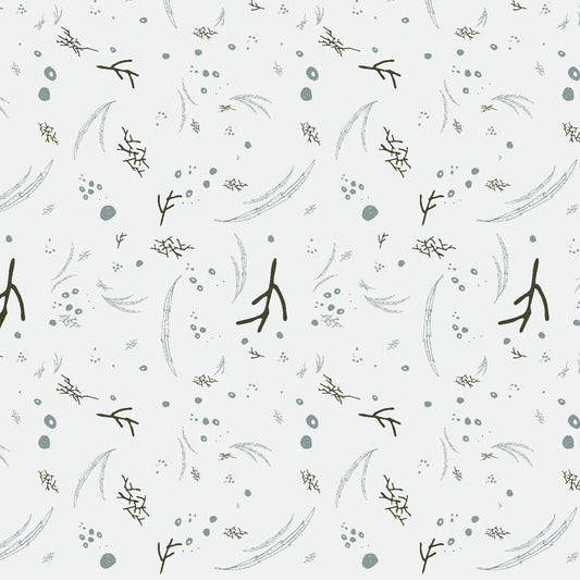 A white fabric print with small branches
