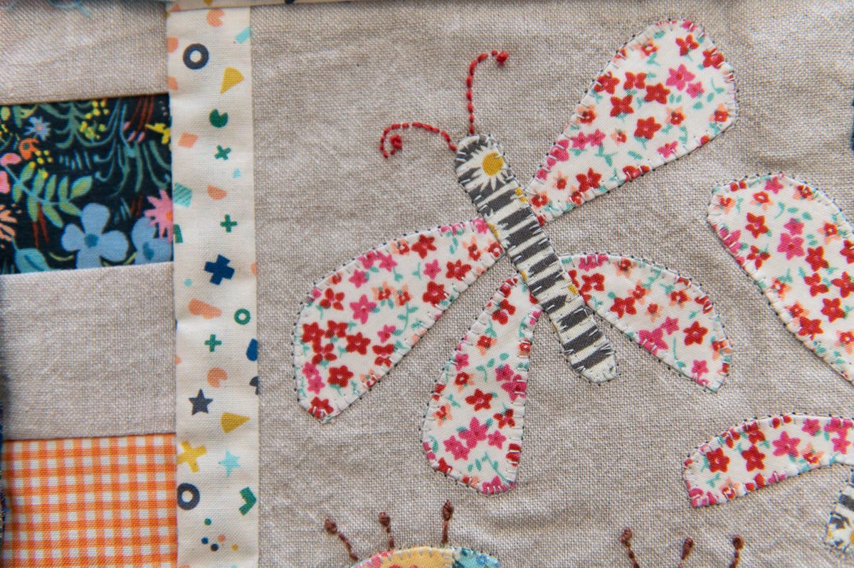 Fabric patchwork with a butterfly design on a textured background