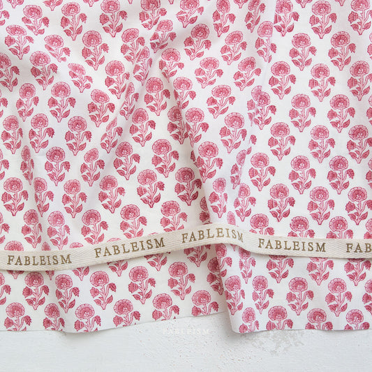 Fableism fabric with pink floral pattern on a white background