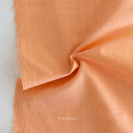 orange fabric against a white background