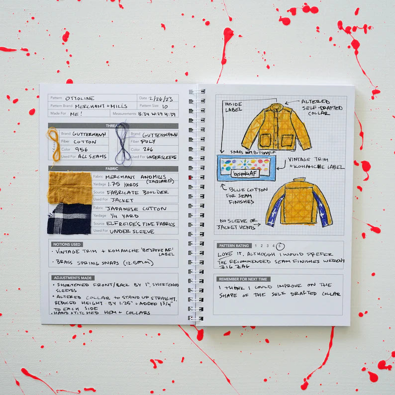 Open sewing journal with garment sewing notes