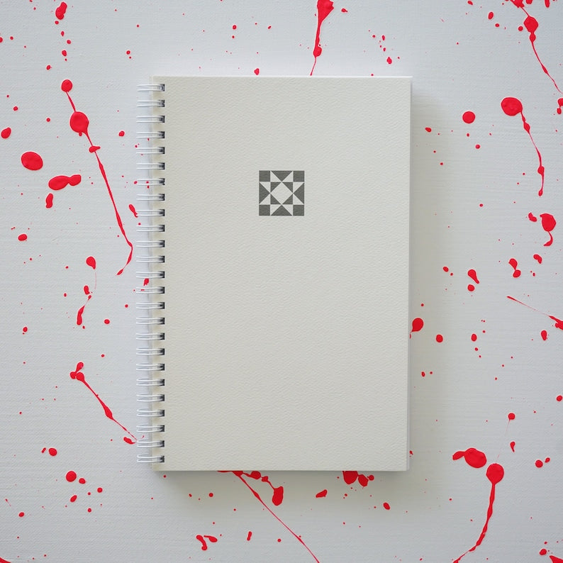 White journal with star on the cover