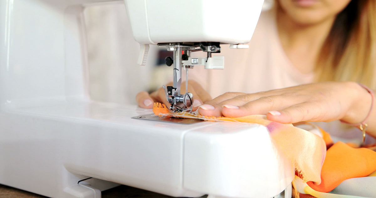 WOMAN-USING-SEWING-MACHINE