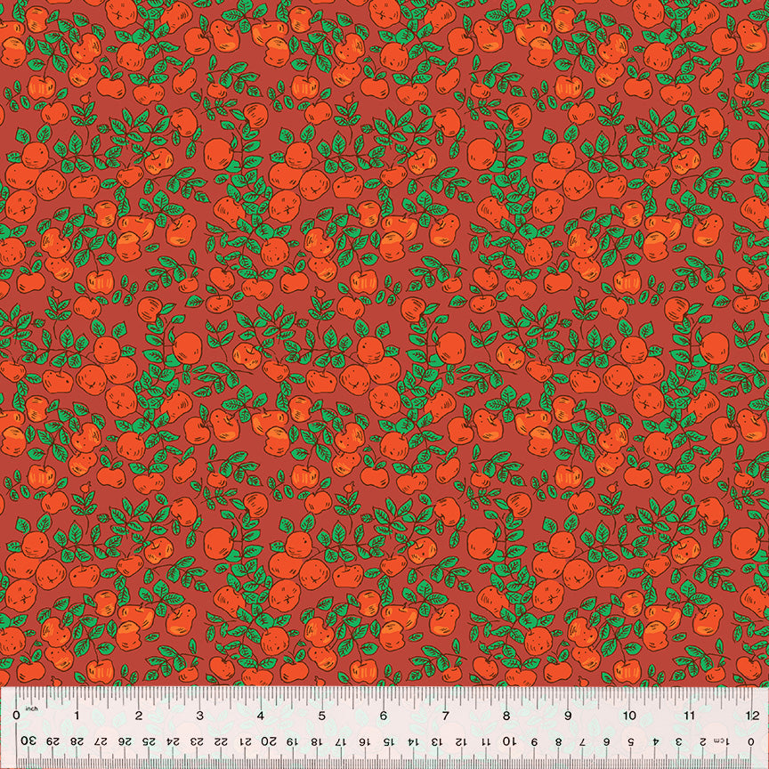 red orange apples on warm red