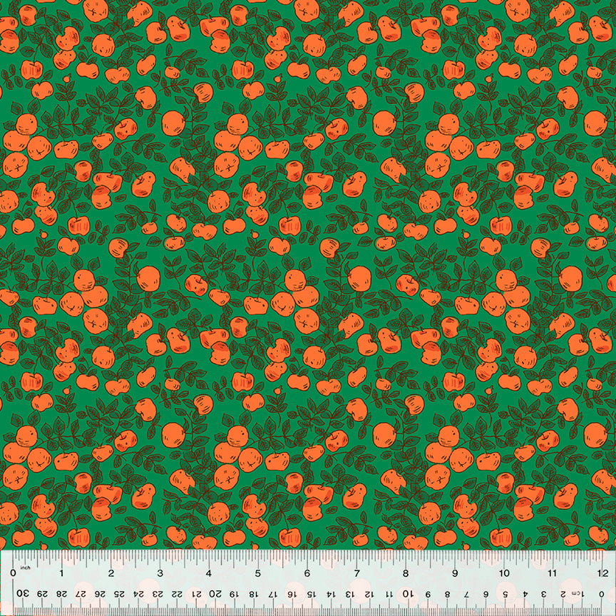 red orange apples on green