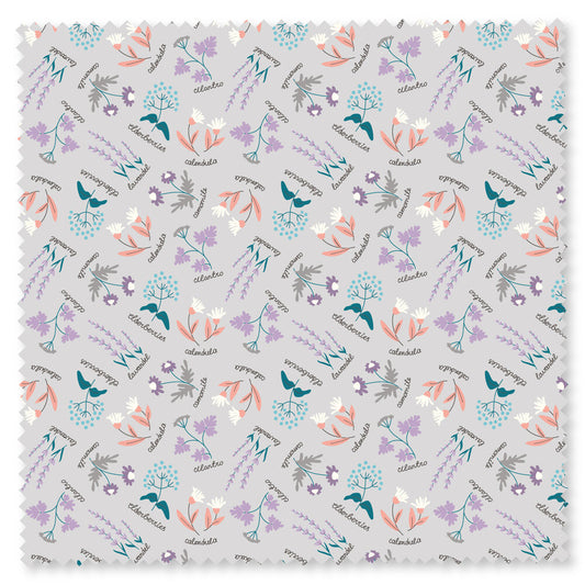 Grey fabric with small purple and orange herbs with cursive writing