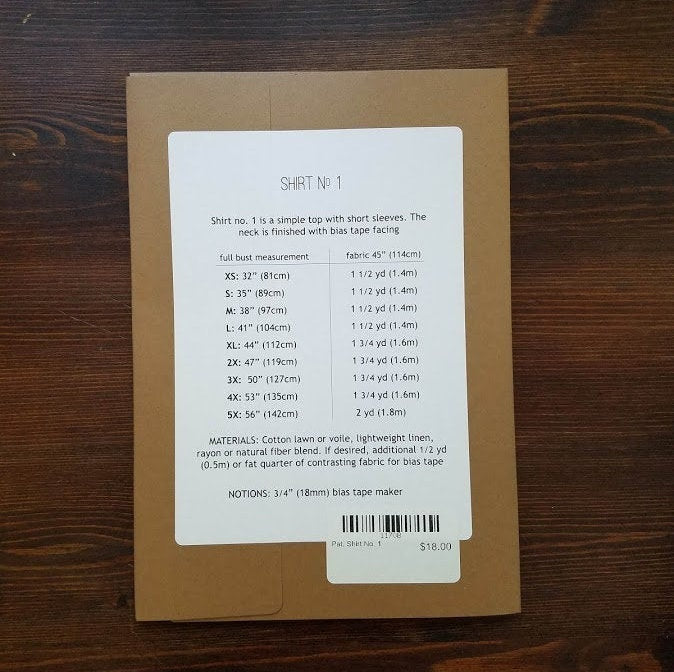 Back of paper pattern packaging with measurment information and yardage requirements.