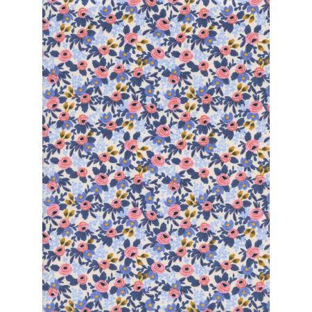 A periwinkle fabric with a floral pattern designed by Rifle Paper Co. featuring pink, blue, and yellow flowers.