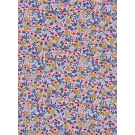 A piece of fabric with a floral pattern featuring pink and yellow flowers on a purple background, from the Menagerie collection by Rifle Paper Co.