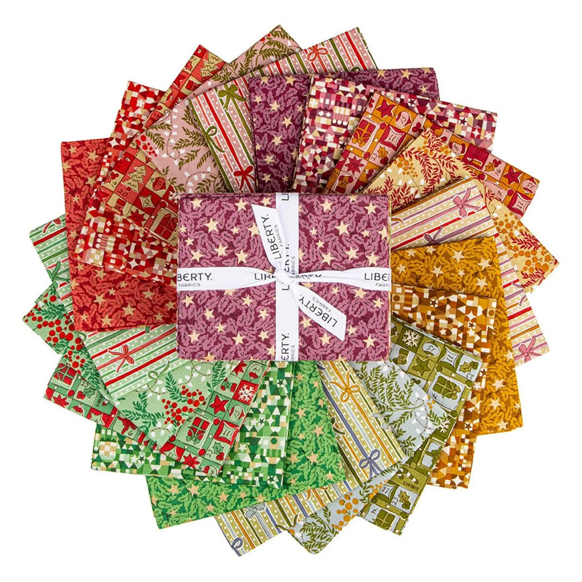 A circular arrangement of Liberty fabrics featuring various holiday-themed patterns, with a central folded fabric bundle wrapped in a white ribbon printed with the brand name 'LIBERTY'.