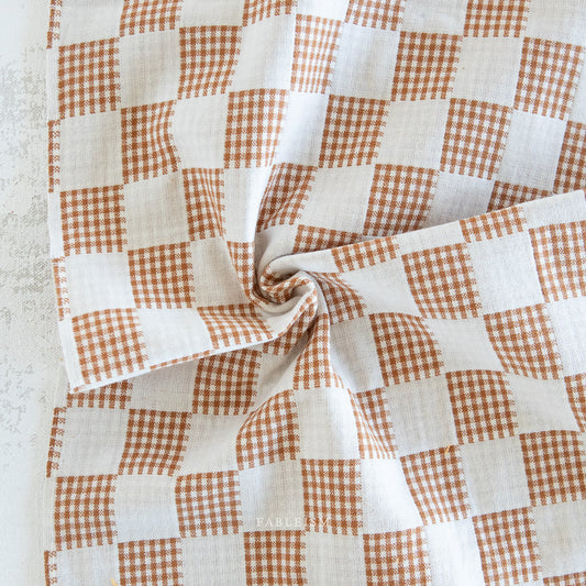 Brown and white checkered fabric 