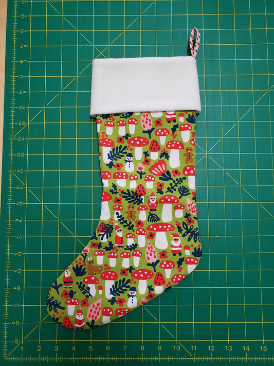 holiday stocking with green and red mushroom print