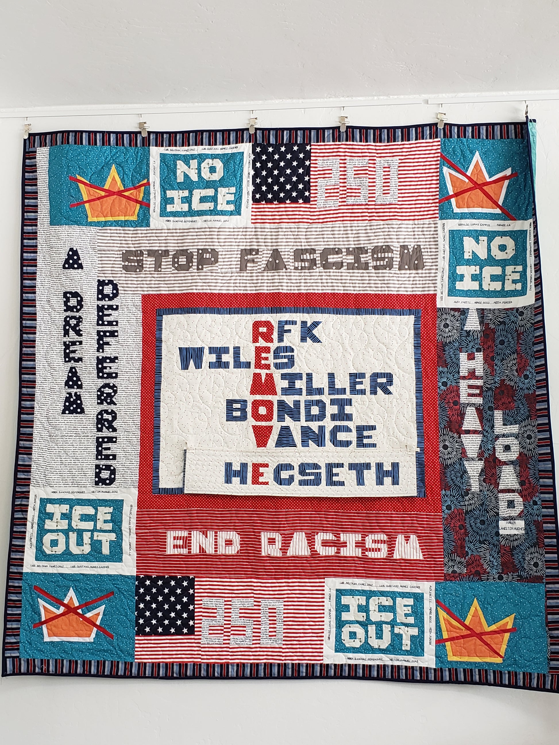Quilt with political-themed text and graphics on a white background