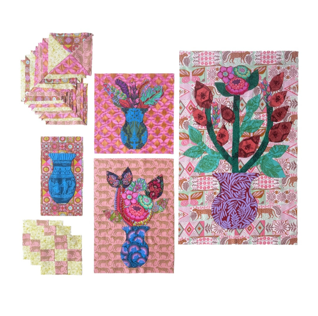 A set of colorful quilted fabric art pieces featuring floral and vase motifs on a white background.