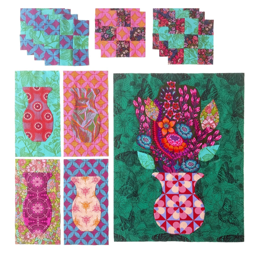 A set of colorful patchwork quilts featuring floral and geometric patterns, including a large quilt with a vase of flowers and six smaller matching quilts arranged on a white background.