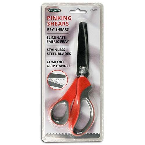Pinking shears with red handles in packaging on a white background