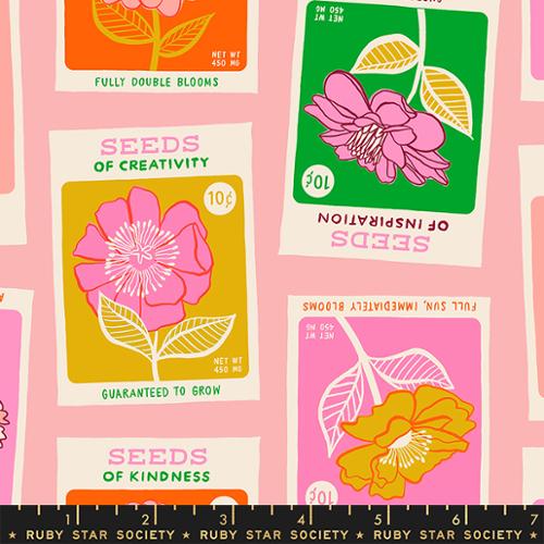 flower seed packs on pink