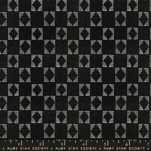 black background with white square shape that outlines a diamond
