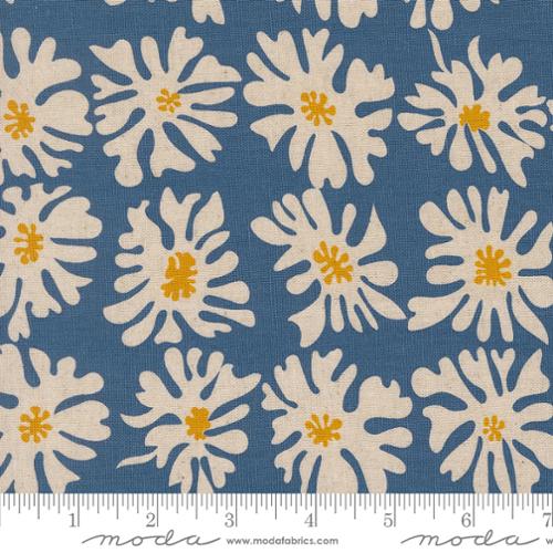 Fabric with white floral pattern on a blue background, featuring Moda label.