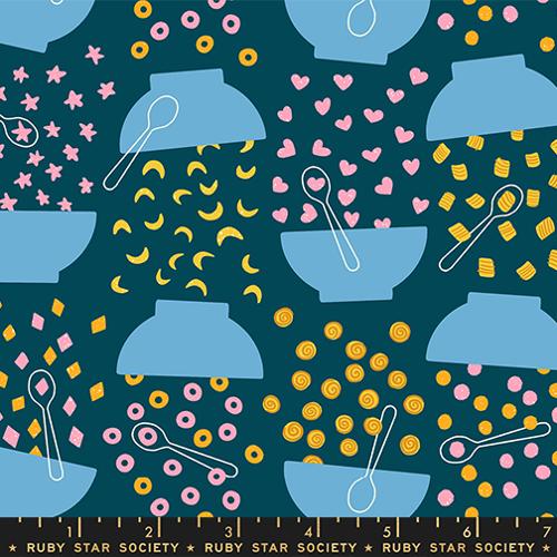 Patterned fabric with blue bowls, yellow and pink shapes on a dark blue background