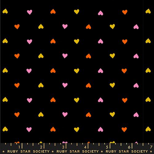 Black fabric with small colored hearts.